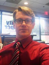 Nels in a color coordinated shirt and tie.